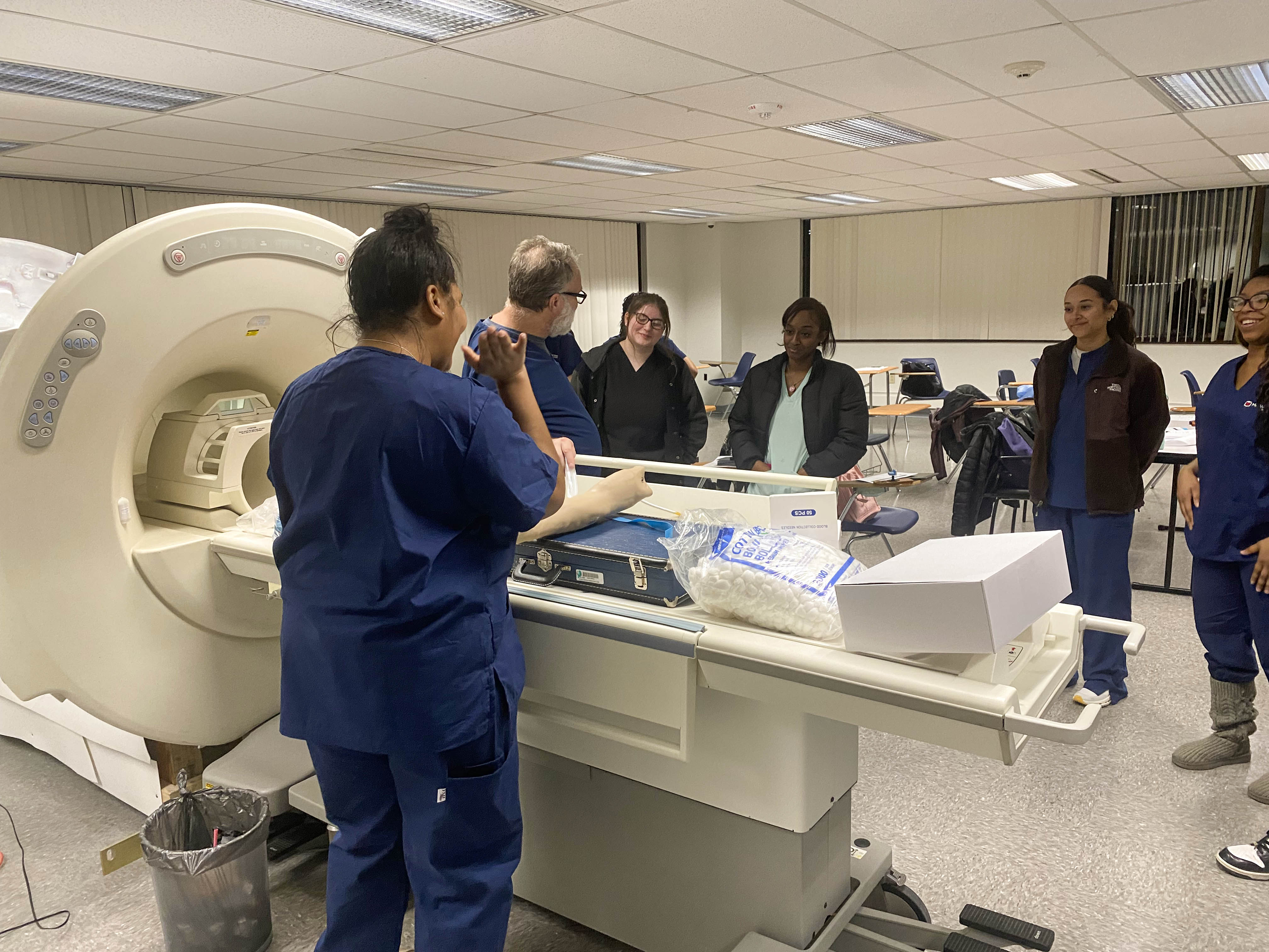 Students learn about MRI equipment used in modern medical imaging environments