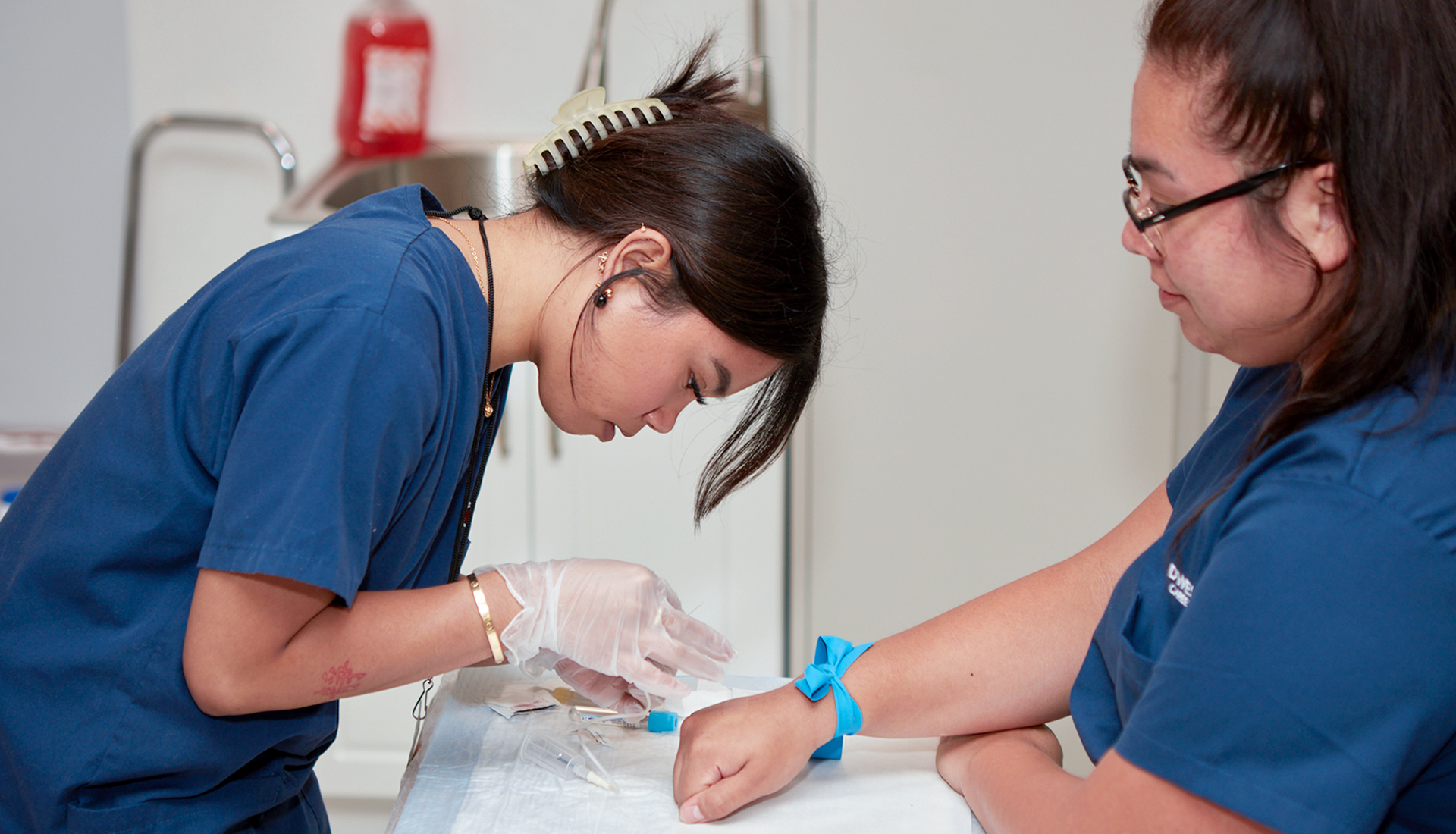 Midwestern Career College phlebotomy students practicing blood collection techniques during hands-on laboratory training