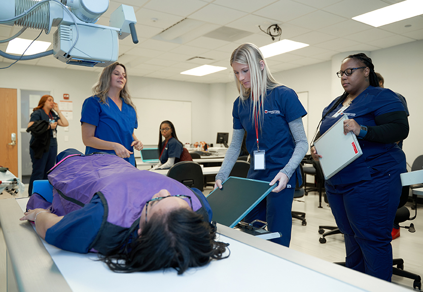 Diagnostic Medical Imaging Radiography students training in an X-ray lab at Midwestern Career College in Chicago