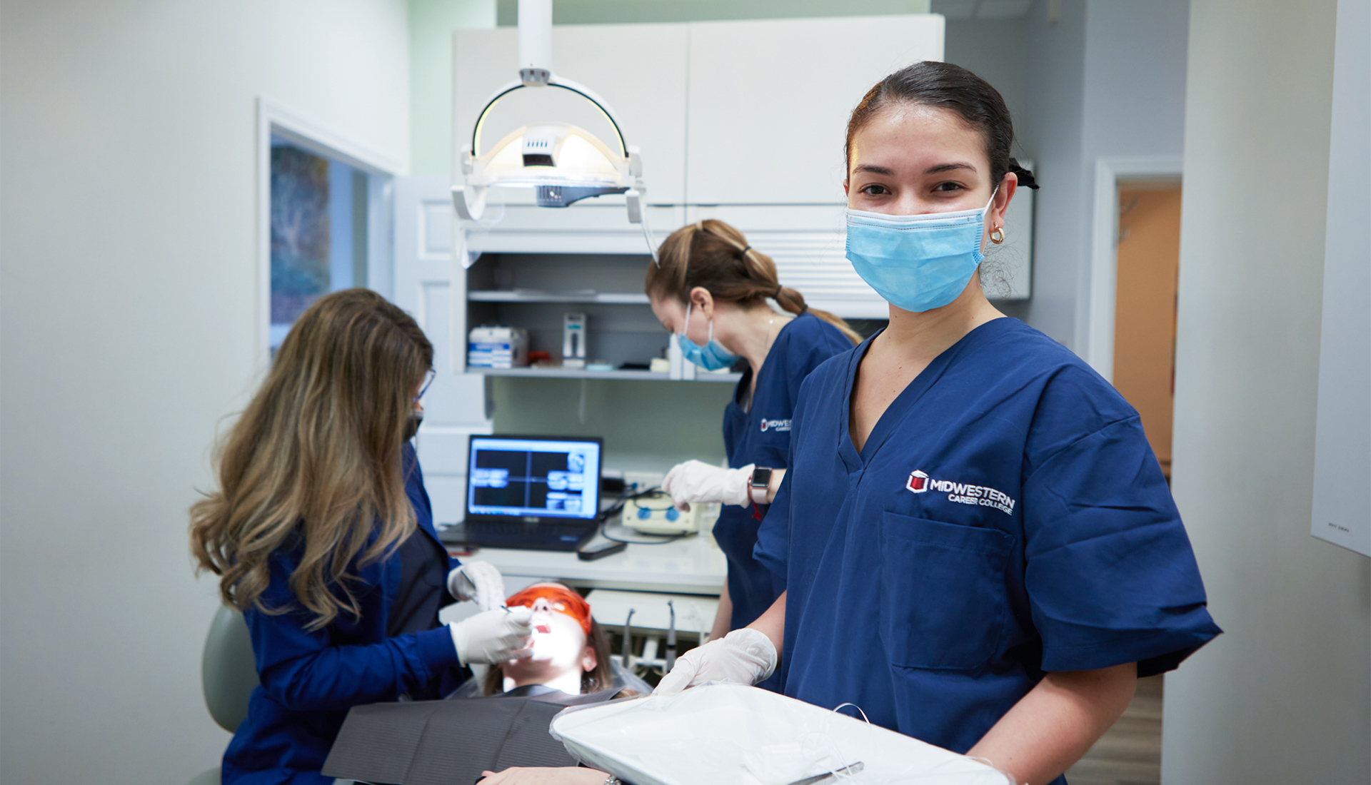 Midwestern Career College dental assisting students practicing clinical patient care skills in a dental lab