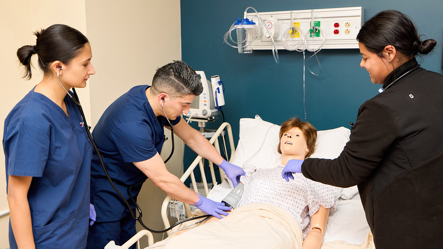 Midwestern Career College Licensed Practical Nursing (LPN) students practicing patient assessment skills in the Chicago campus simulation lab.